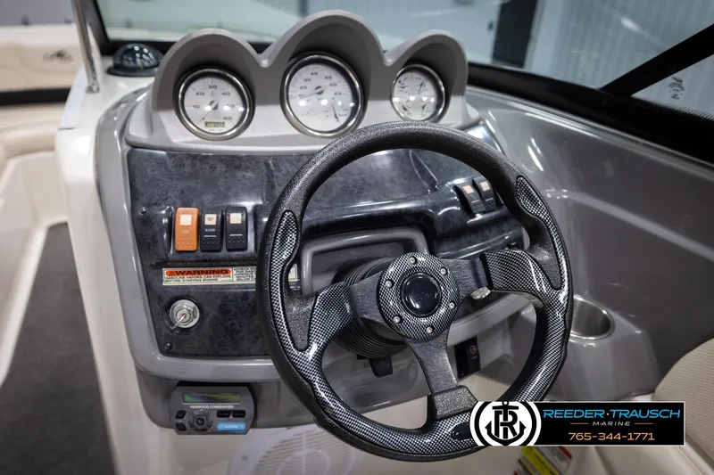 Slide: The Image of Steering wheel and dashboard of a 2007 Monterey 234 FS boat. - 31