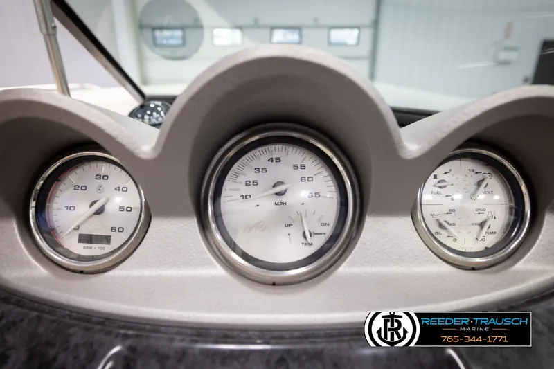 Slide: The Image of Dashboard gauges of a 2007 Monterey 234 FS boat, featuring speedometer and tachometer. - 35