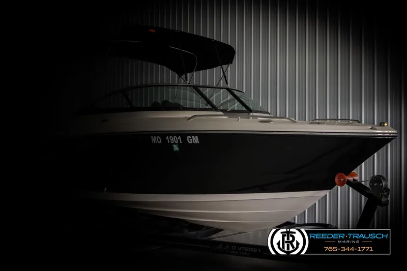 Slide: The Image of 2007 Monterey 234 FS boat in storage, partially illuminated, with visible registration number. - 4