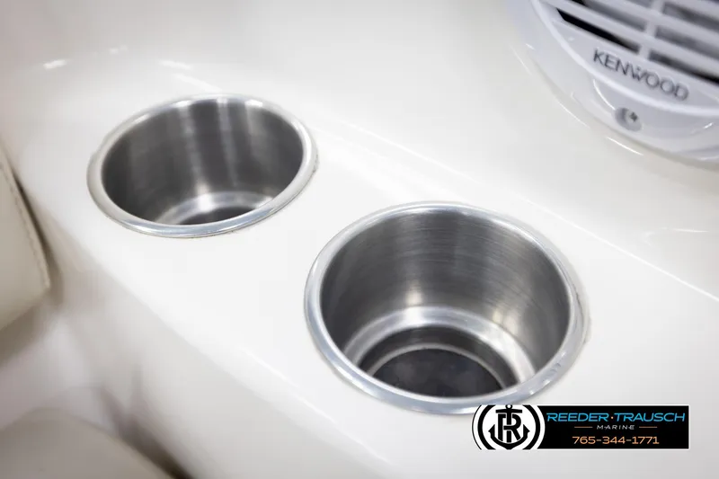 Slide: The Image of Stainless steel cup holders on a 2007 Monterey 234 FS boat interior. - 44
