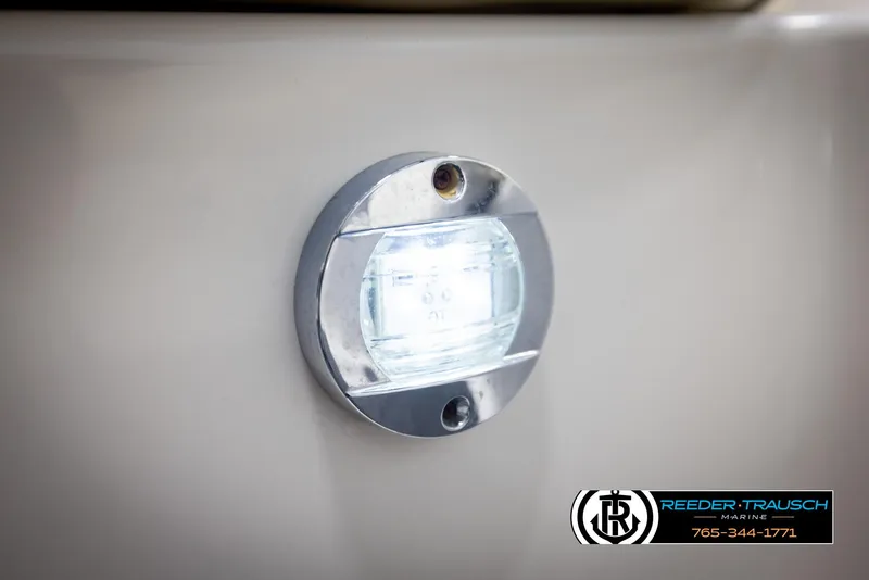 Slide: The Image of Close-up of a 2007 Monterey 234 FS boat light with Reeder-Trausch Marine logo. - 45