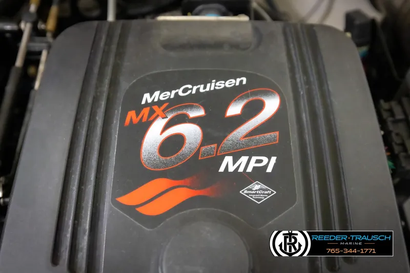 Slide: The Image of MerCruiser MX 6.2 MPI engine cover on a 2007 Monterey 234 FS boat. - 47