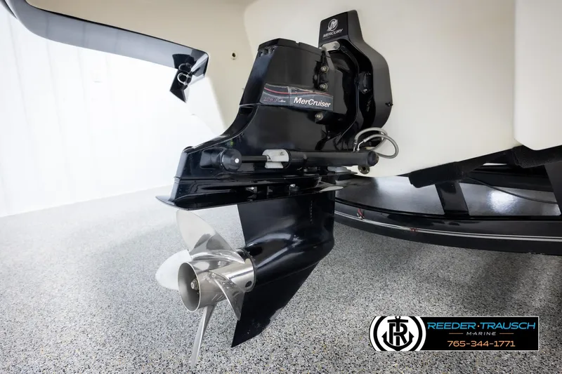 Slide: The Image of 2007 Monterey 234 FS boat with MerCruiser outdrive, displayed in showroom. - 48