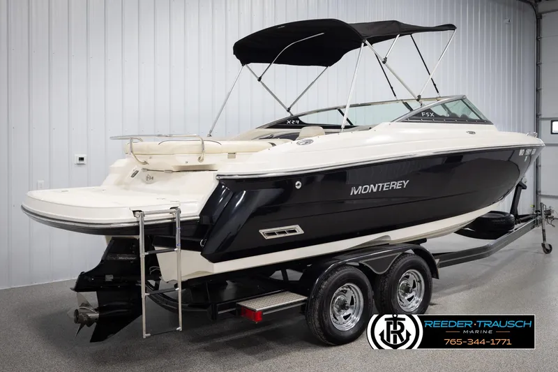Slide: The Image of 2007 Monterey 234 FS boat on trailer in indoor showroom. - 6