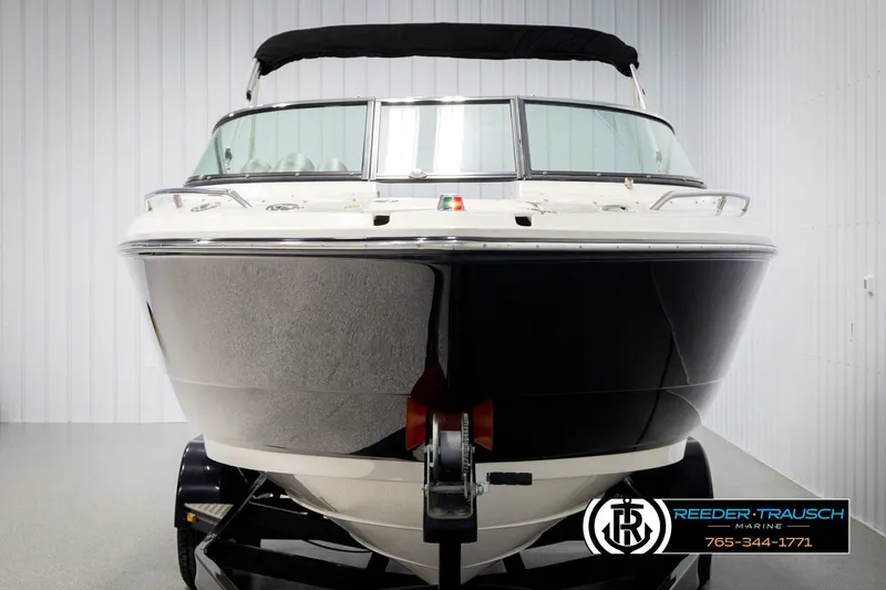Slide: The Image of 2007 Monterey 234 FS boat, black and white, front view in showroom. - 8