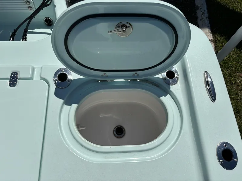 Slide: The Image of Open hatch on 2024 Clark Sound 24 boat, revealing storage compartment. - 13