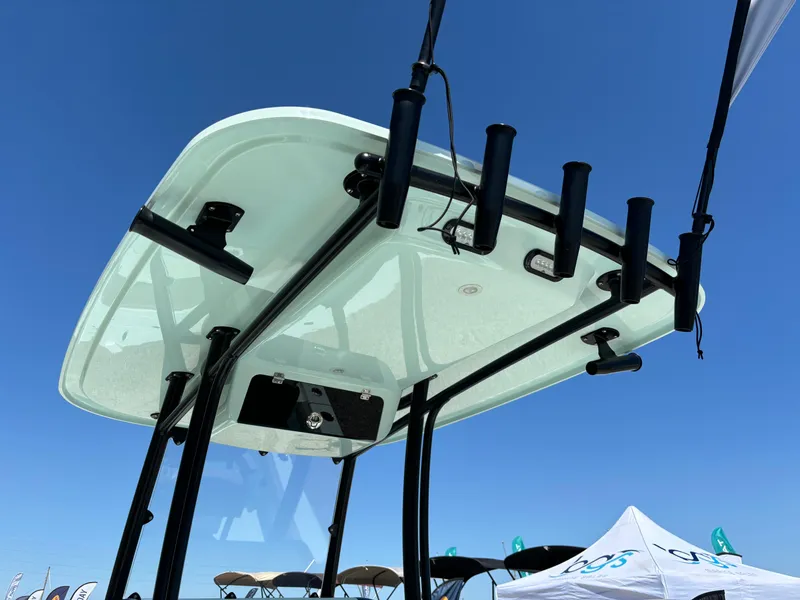 Slide: The Image of T-top of 2024 Clark Sound 24 boat with rod holders against clear blue sky. - 25