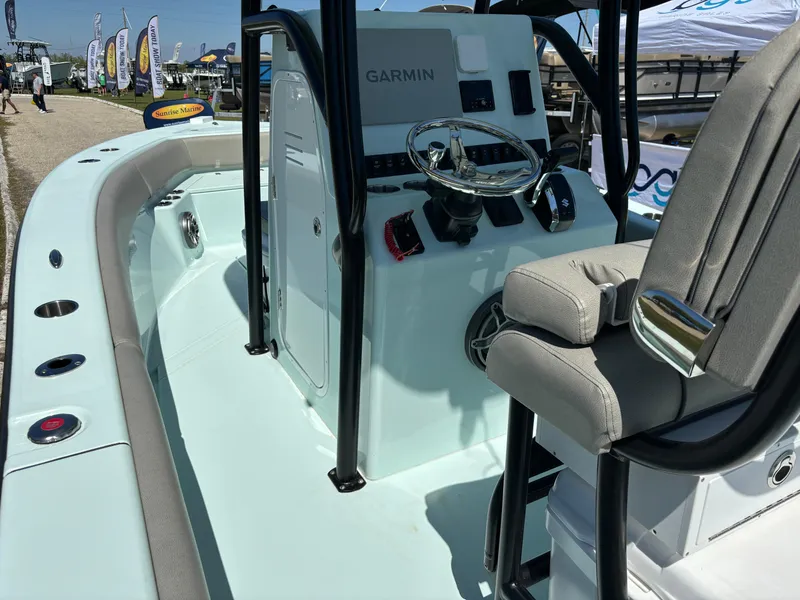 Slide: The Image of 2024 Clark Sound 24 boat interior with Garmin navigation, sleek design, and comfortable seating. - 26