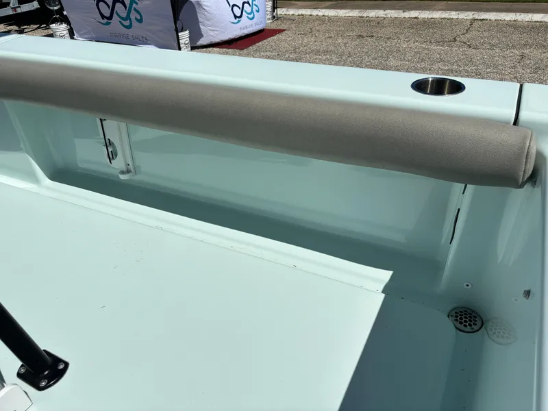 Slide: The Image of 2024 Clark Sound 24 boat interior with cushioned rail and cup holder. - 27