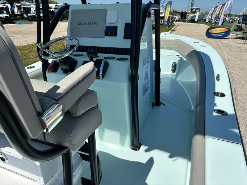 Slide: The Image of 2024 Clark Sound 24 boat interior with Garmin navigation, sleek design, and comfortable seating. - 28