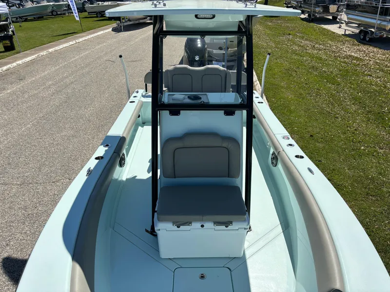 Slide: The Image of 2024 Clark Sound 24 boat with center console and seating, displayed outdoors. - 45