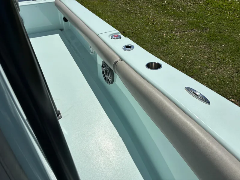 Slide: The Image of 2024 Clark Sound 24 boat interior with padded railing and cup holders. - 46