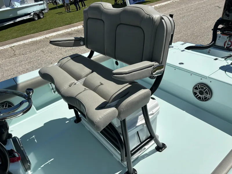 Slide: The Image of Clark Sound 24 boat seat, 2024 model, featuring cushioned seating and armrests on a sunny day. - 49