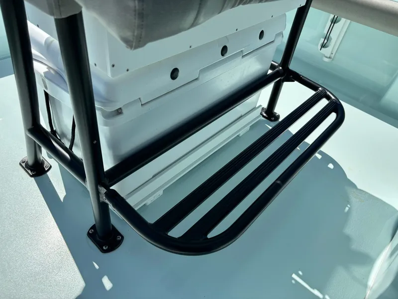 Slide: The Image of Footrest on 2024 Clark Sound 24 boat, featuring sturdy black metal design. - 51