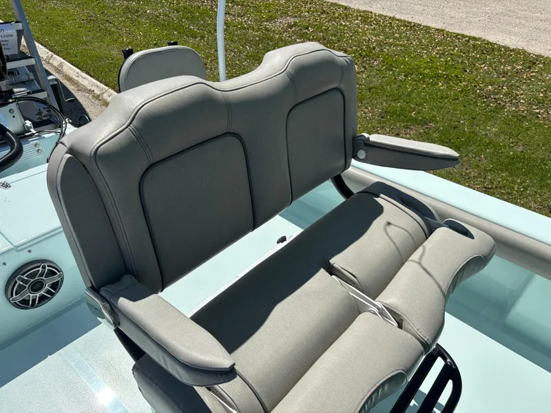 Slide: The Image of Gray seating on 2024 Clark Sound 24 boat, featuring armrests and cup holders. - 52