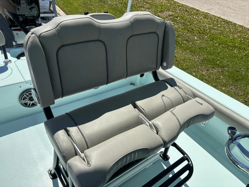 Slide: The Image of Gray seating on a 2024 Clark Sound 24 boat, featuring cushioned backrest and armrests. - 53