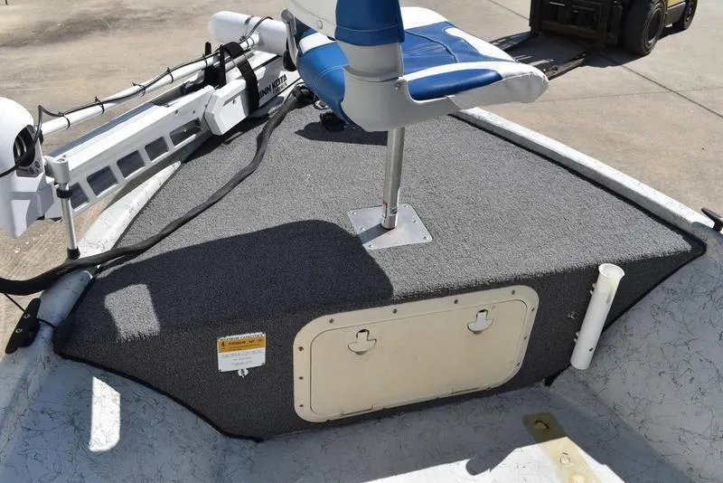 Slide: The Image of 1996 Kenner 16v boat deck with blue seat and trolling motor. - 10