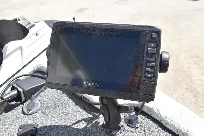 Slide: The Image of Garmin GPS device mounted on a 1996 Kenner 16v boat dashboard. - 11