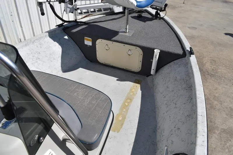 Slide: The Image of 1996 Kenner 16v boat interior with seating and mounted equipment. - 13