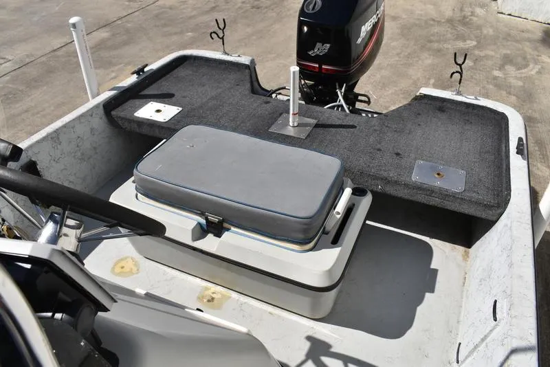 Slide: The Image of 1996 Kenner 16v boat interior with motor and seating area. - 17