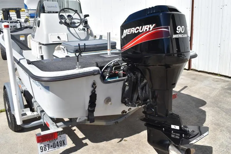 Slide: The Image of 1996 Kenner 16v boat with Mercury 90 outboard motor on trailer. - 4