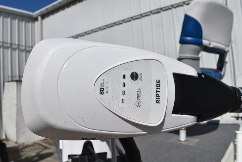 Slide: The Image of Riptide motor on a 1996 Kenner 16v boat, close-up view. - 9