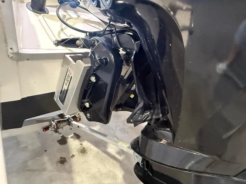Slide: The Image of 2015 Sea Born FX22 boat engine and steering mechanism close-up. - 10