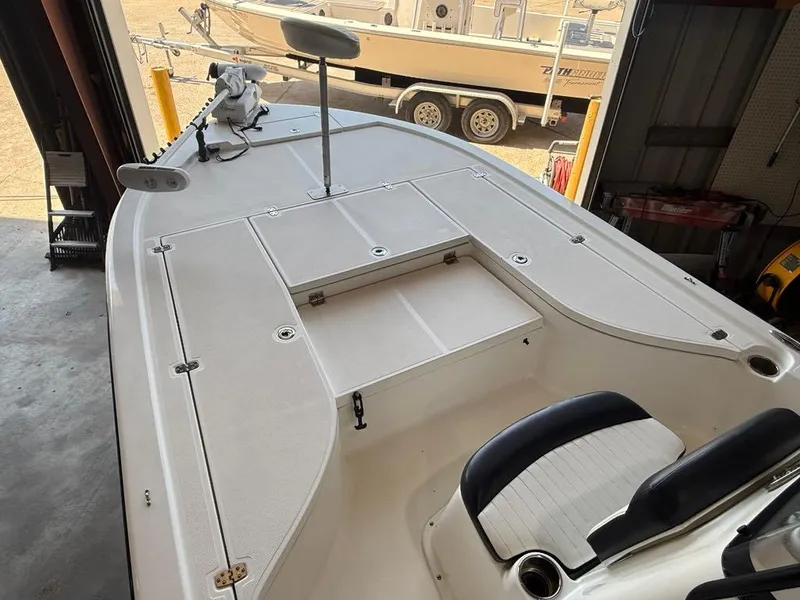Slide: The Image of 2015 Sea Born FX22 boat interior with seating and storage compartments. - 14