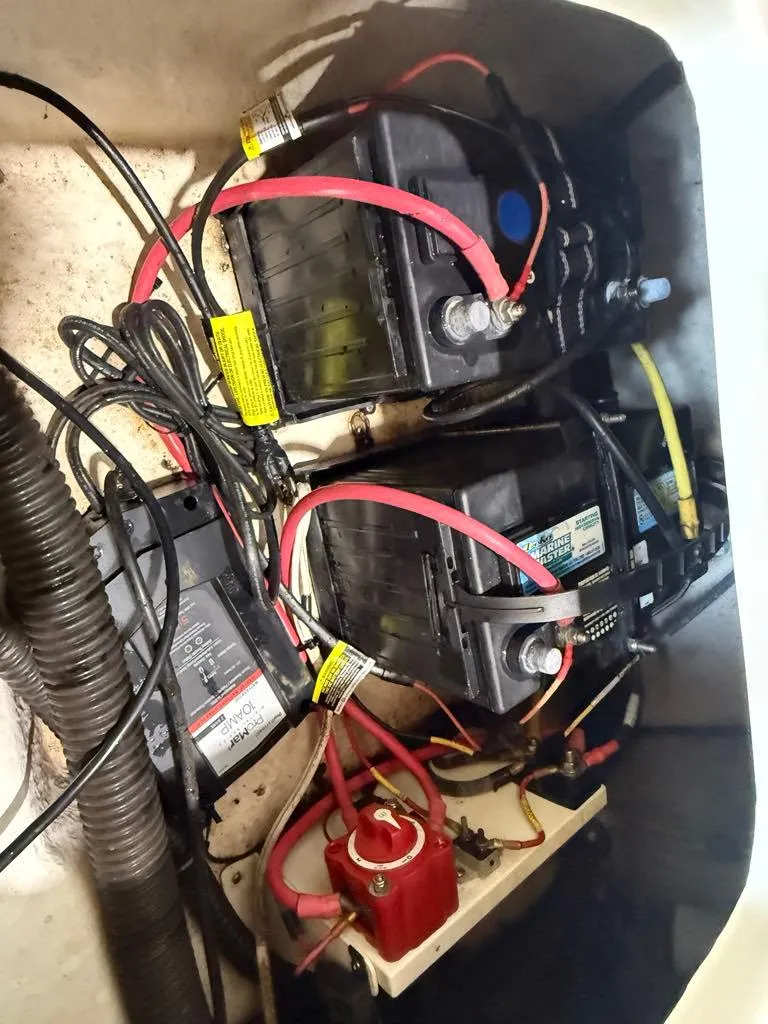 Slide: The Image of 2015 Sea Born FX22 boat battery compartment with wiring and components. - 15