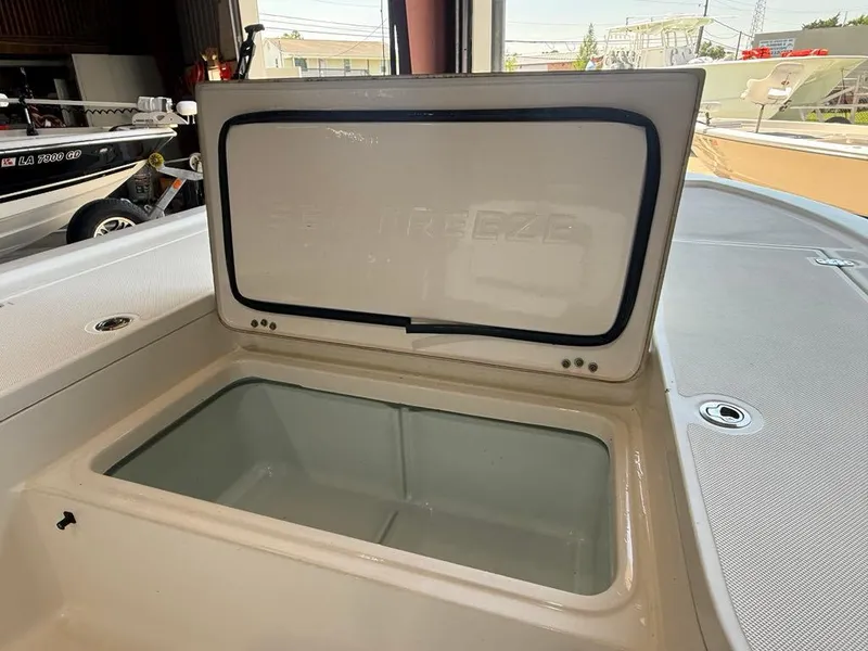 Slide: The Image of 2015 Sea Born FX22 boat storage compartment with open lid. - 8
