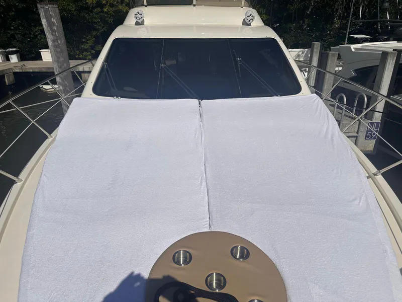 Slide: The Image of 2007 Azimut 55E yacht with sunbathing deck, docked at marina. - 13