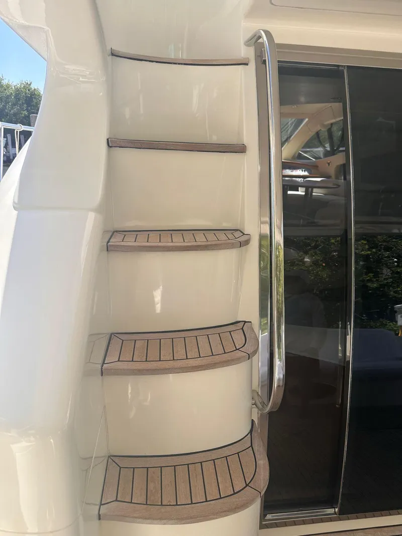 Slide: The Image of Staircase on 2007 Azimut 55E yacht with wooden steps and metal railing. - 19