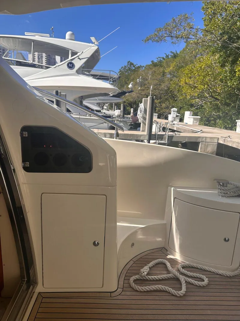 Slide: The Image of 2007 Azimut 55E yacht docked, featuring sleek design and modern amenities. - 3