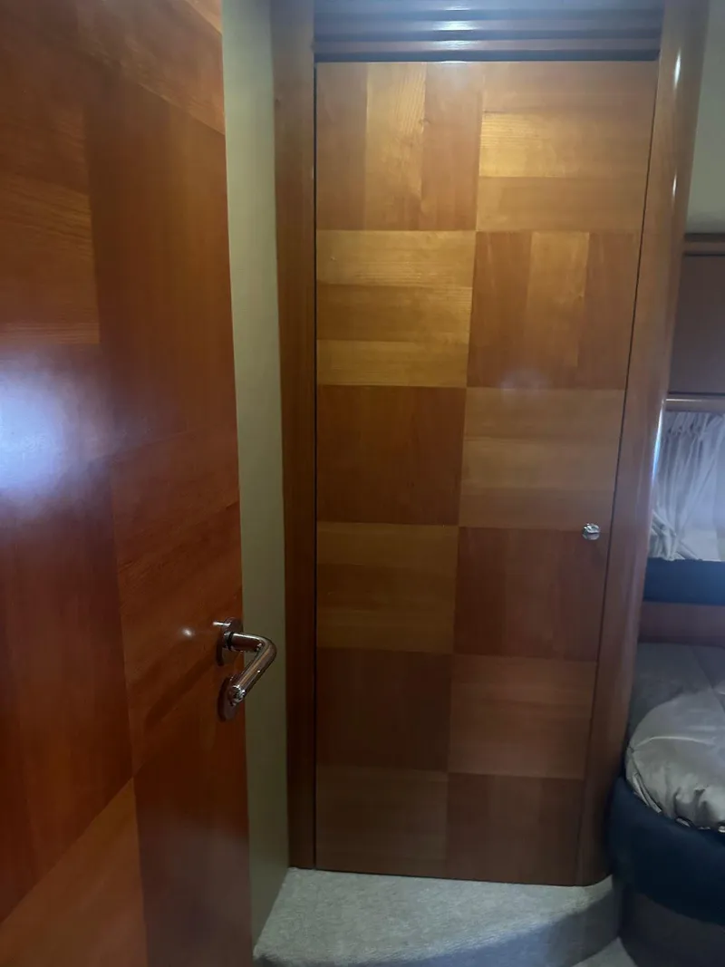 Slide: The Image of Interior of 2007 Azimut 55E yacht with wooden door and cozy cabin. - 9