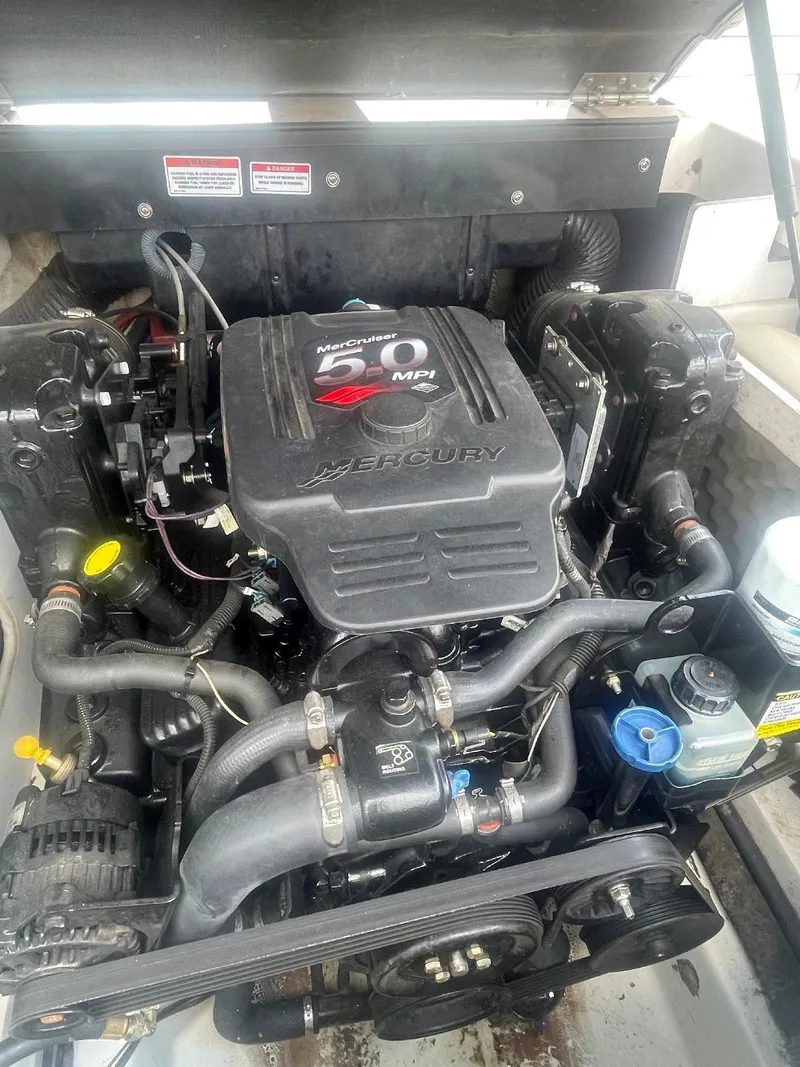 Slide: The Image of 2007 Sea Ray 210 Select engine compartment with Mercury engine components visible. - 5