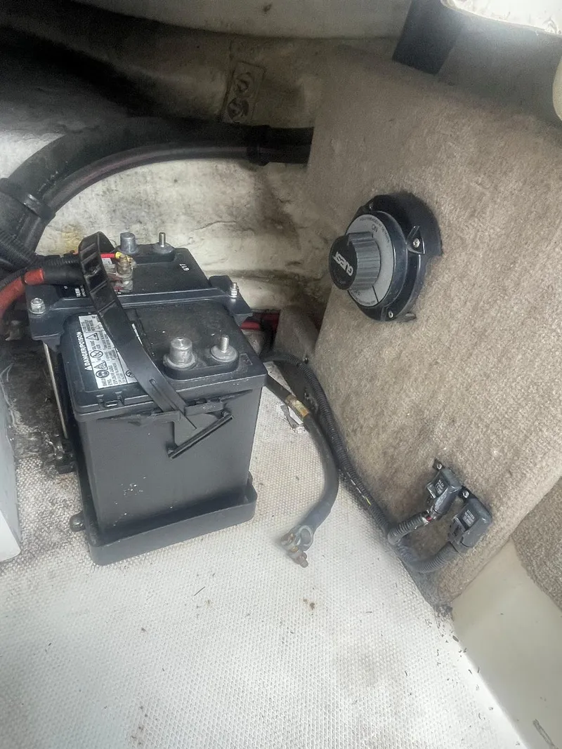 Slide: The Image of Battery compartment of 2007 Sea Ray 210 Select boat, featuring wiring and control panel. - 7