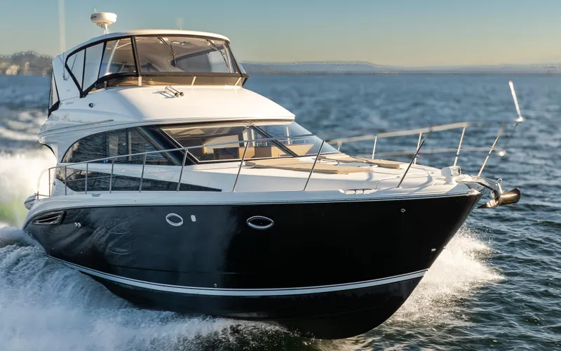 Slide: The Image of 2015 Meridian 441 Sedan yacht cruising on open water. - 1