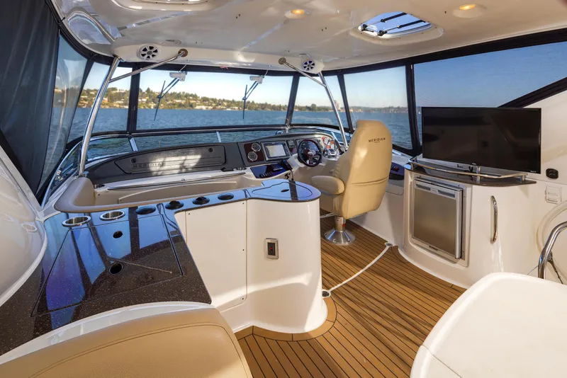 Slide: The Image of Luxurious 2015 Meridian 441 Sedan yacht interior with modern helm and panoramic windows. - 11