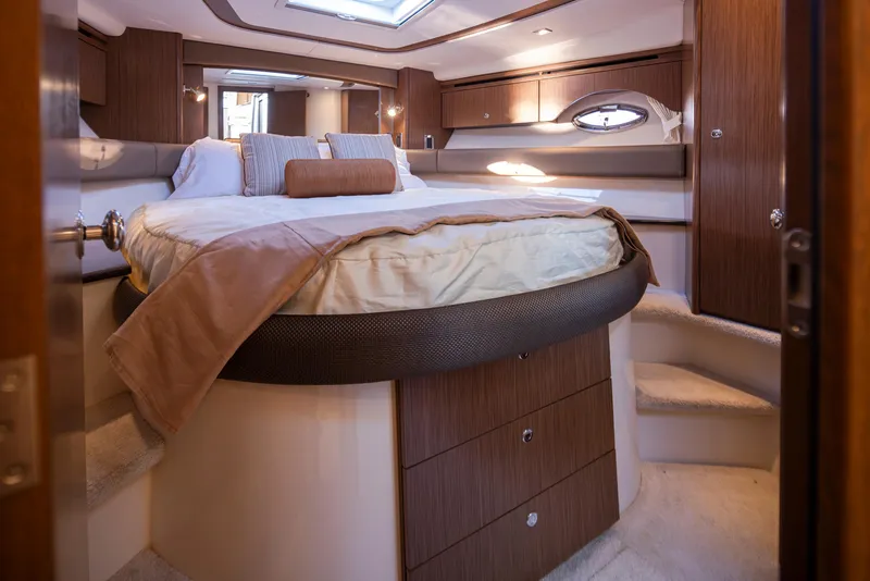 Slide: The Image of Luxurious bedroom interior of 2015 Meridian 441 Sedan yacht with elegant wood finishes. - 19
