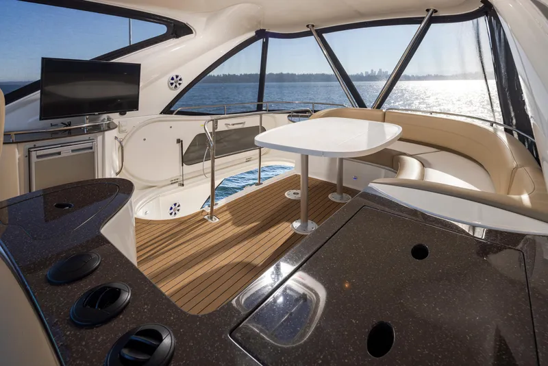 Slide: The Image of Luxurious interior of 2015 Meridian 441 Sedan yacht with elegant seating and scenic water view. - 29