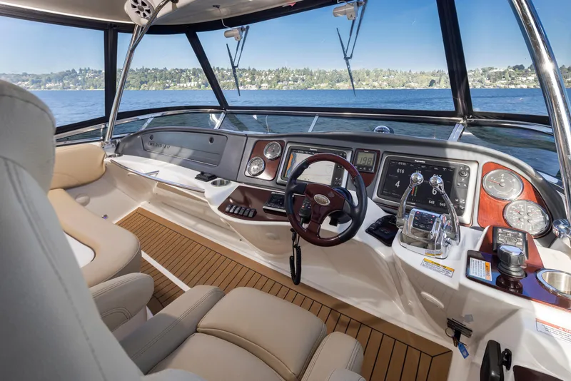 Slide: The Image of Luxurious 2015 Meridian 441 Sedan yacht cockpit with modern controls and panoramic water view. - 32