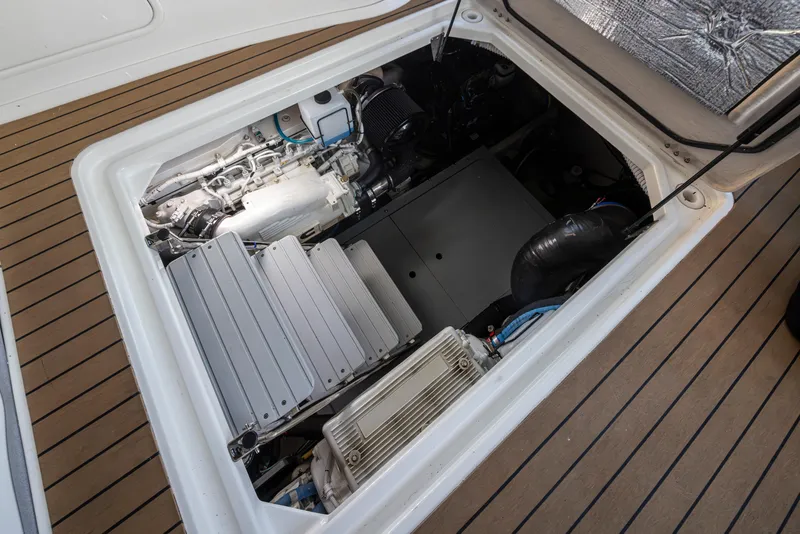Slide: The Image of Engine compartment of a 2015 Meridian 441 Sedan yacht, showcasing mechanical components. - 39