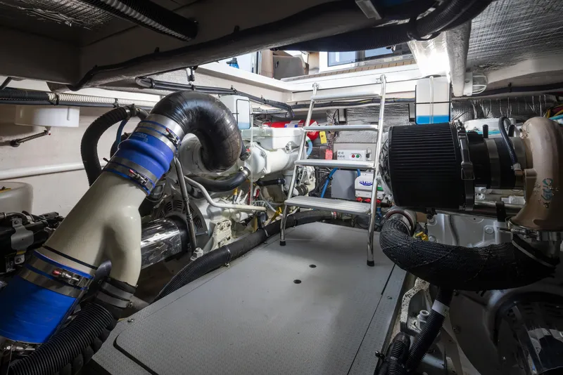 Slide: The Image of Engine room of 2015 Meridian 441 Sedan yacht, featuring complex machinery and equipment. - 42