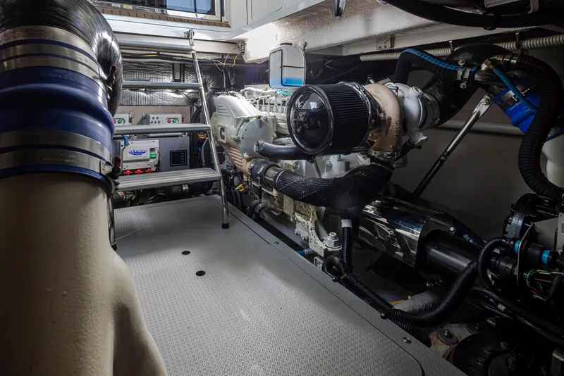Slide: The Image of Engine room of 2015 Meridian 441 Sedan yacht, showcasing machinery and equipment. - 43