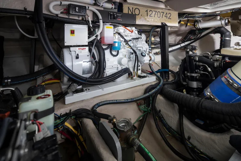 Slide: The Image of Engine room of a 2015 Meridian 441 Sedan with visible machinery and wiring. - 45