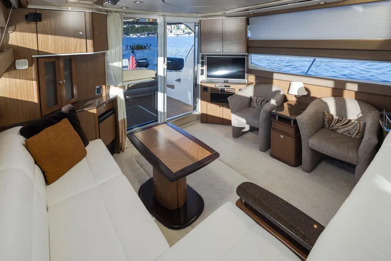 Slide: The Image of Luxurious interior of 2015 Meridian 441 Sedan yacht with elegant seating and scenic water view. - 6