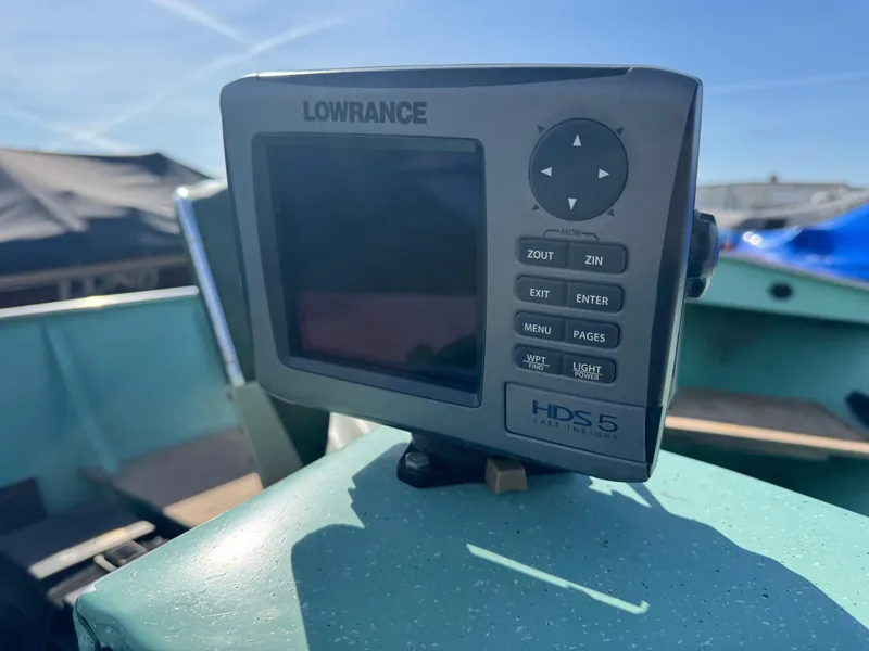 Slide: The Image of Lowrance HDS-5 fishfinder on 1979 Lund L boat, sunny day, outdoor setting. - 6