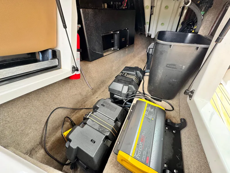 Slide: The Image of 2022 MasterCraft XStar interior showing battery setup and storage area. - 30