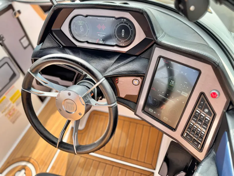 Slide: The Image of 2022 MasterCraft XStar dashboard with modern controls and touchscreen display. - 33