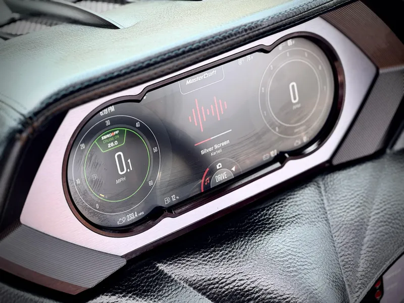 Slide: The Image of 2022 MasterCraft XStar dashboard display with digital gauges and controls. - 35